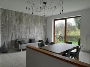 a living room with a table and a couch at Fuori dal Borgo.... in Vitorchiano