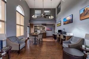 a waiting room with chairs and tables in a hospital at Clarion Inn Kingman I-40 Route 66 in Kingman