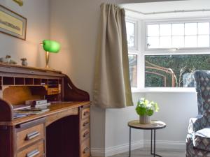 a room with a desk and a window at Meadowview in Honington