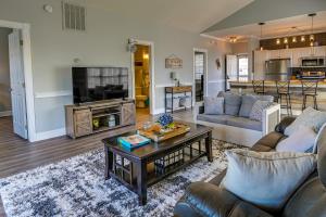 a living room with a couch and a table at Idyllic Myrtle Beach Condo Golf Course On-Site in Myrtle Beach