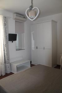 A bed or beds in a room at B&B Home Sweet Home Rosolini