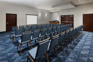 a row of chairs in a room with a whiteboard at Courtyard by Marriott Atlantic City Beach Block in Atlantic City