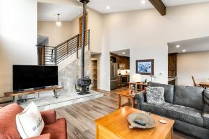 a living room with a flat screen tv and a fireplace at Mount Royal in Frisco