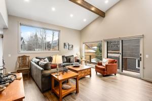 a living room with a couch and a table at Mount Royal in Frisco