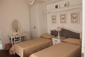 A bed or beds in a room at B&B Home Sweet Home Rosolini