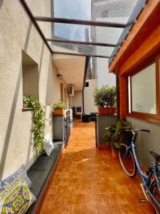 an empty hallway with a bike parked in a building at La Vie Fuille Bed and Breakfast in Riposto