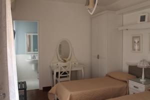 A bed or beds in a room at B&B Home Sweet Home Rosolini