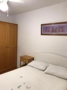 Postel nebo postele na pokoji v ubytování ROMANTICO
