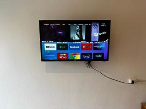 a flat screen tv hanging on a wall at Green Paradise in North Pattaya