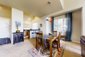 a kitchen and dining room with a table and chairs at Eagle Crest Nest in Redmond