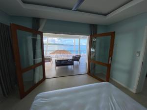 Postel nebo postele na pokoji v ubytování Nasara Resort Mentawai