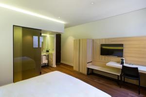 Postel nebo postele na pokoji v ubytování Hotel Altiplanico Bellas Artes