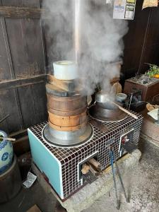 a stack of pots and pans on top of a stove at Wan de En - Vacation STAY 83694v in Sabae