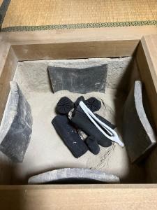 a box with a pair of shoes and a knife at Wan de En - Vacation STAY 83694v in Sabae