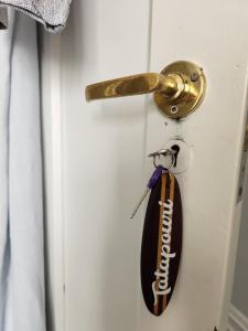 a key hanging from a door handle at Cedar House in Gisborne