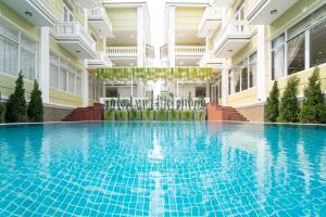 a swimming pool in the middle of a building at Hawal Boutique Villa Hoi An in Hoi An
