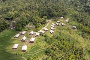 an aerial view of a group of tents in a field at Kaura Manggis, Bali - Luxury Tent in Candidasa