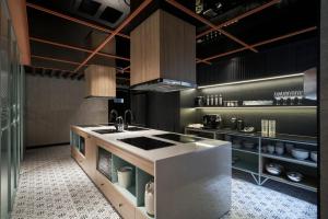 a kitchen with a sink and a counter top at M Village Tôn Thất Đạm in Ho Chi Minh City