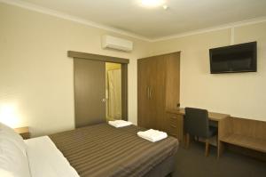 Postel nebo postele na pokoji v ubytování Seabrook Hotel