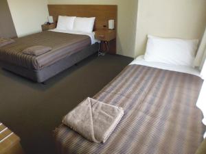 Postel nebo postele na pokoji v ubytování Seabrook Hotel