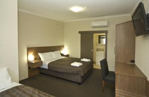 Postel nebo postele na pokoji v ubytování Seabrook Hotel