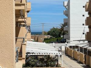a view of a building with white roofs and plants at Apartamento Peonia 2 in Canet de Berenguer