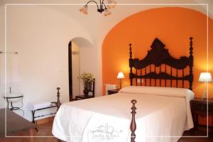 Llit o llits en una habitació de Casa Rural Doña Blanca