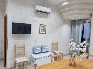 TV a/nebo společenská místnost v ubytování Casa Vacanza Sweet Home