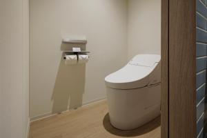 a bathroom with a white toilet in a room at Fairfield by Marriott Okayama Tsuyama in Tuyama