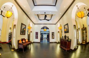 a large room with a large ceiling and a hallway at Sokchea Angkor Hotel in Siem Reap