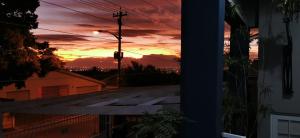 a sunset seen from a window of a house at Tranquility in Parow