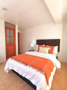Rúm í herbergi á Cusco Kintu House
