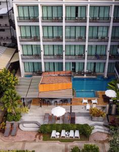 an overhead view of a building with a swimming pool at Aonang Viva Resort - SHA Plus in Ao Nang Beach