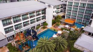 an overhead view of a hotel with a swimming pool at Aonang Viva Resort - SHA Plus in Ao Nang Beach
