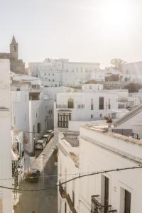 an aerial view of a city with white buildings at Casa Uva - Boutique Stay in Vejer de la Frontera