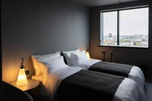 Ein Bett oder Betten in einem Zimmer der Unterkunft Zonar Zagreb by Maistra City Vibes