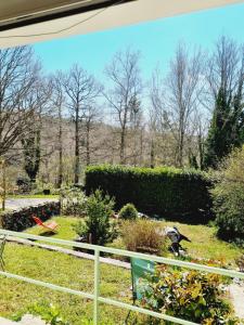 a garden view from the window of a house at Les Tables Aux Vaches - Maison d'Hôtes - Table d'Hôtes sous conditions in La Salvetat