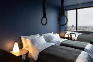 Ein Bett oder Betten in einem Zimmer der Unterkunft Zonar Zagreb by Maistra City Vibes