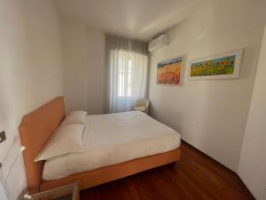 Postel nebo postele na pokoji v ubytování Lolli Palace Hotel