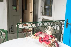 a vase of flowers sitting on top of a table at Brukenthal Central Apartments Sibiu in Sibiu