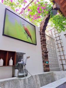 Televiisor ja/või meelelahutuskeskus majutusasutuses Hoi An Chic - Green Retreat