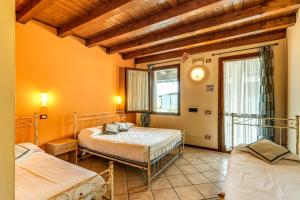 Postel nebo postele na pokoji v ubytování Agriturismo Pozzo Fiorito