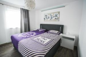 Giường trong phòng chung tại Apartment Ma&Ja with Hot Tub