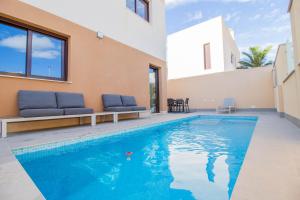 a swimming pool in the backyard of a house at 3083 Casa Nueve in San Pedro del Pinatar
