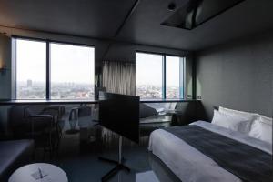 Ein Bett oder Betten in einem Zimmer der Unterkunft Zonar Zagreb by Maistra City Vibes