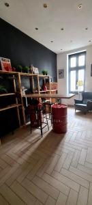 a living room with a table and a couch and a floor at City center apartment in Sopron