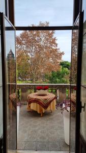 a view from a glass door of a patio with a table at B& B Cà de Andreas in Catania