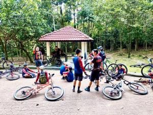 a group of people with their bikes in a park at Eco Resort Beverly Hills in Ipoh