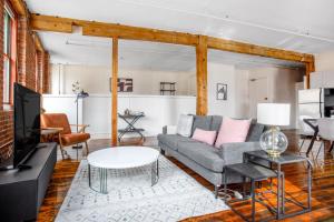 a living room with a couch and a table at S End Loft w Pool Art Gallery Steps to T BOS-356 in Boston