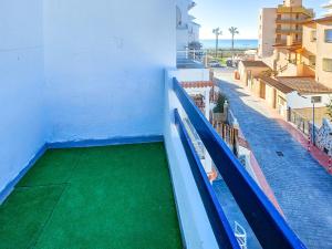 a balcony with a swimming pool on a building at Playa de Peñíscola - Ideal familias 6-7 pax o Parejas 2-4 pax - terraza - parking in Peniscola